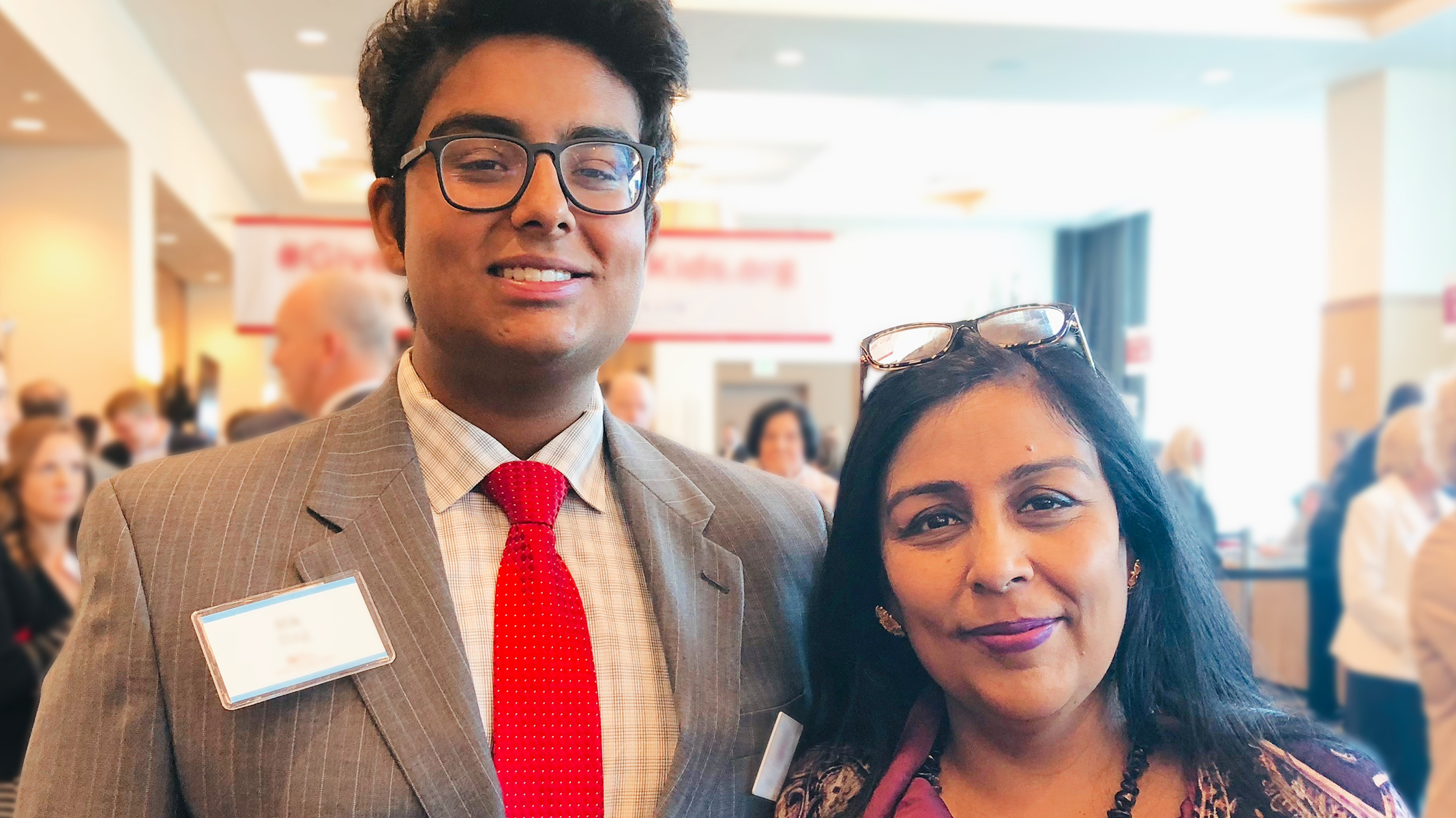 A parent and adult child attending a patient event at Lilly.