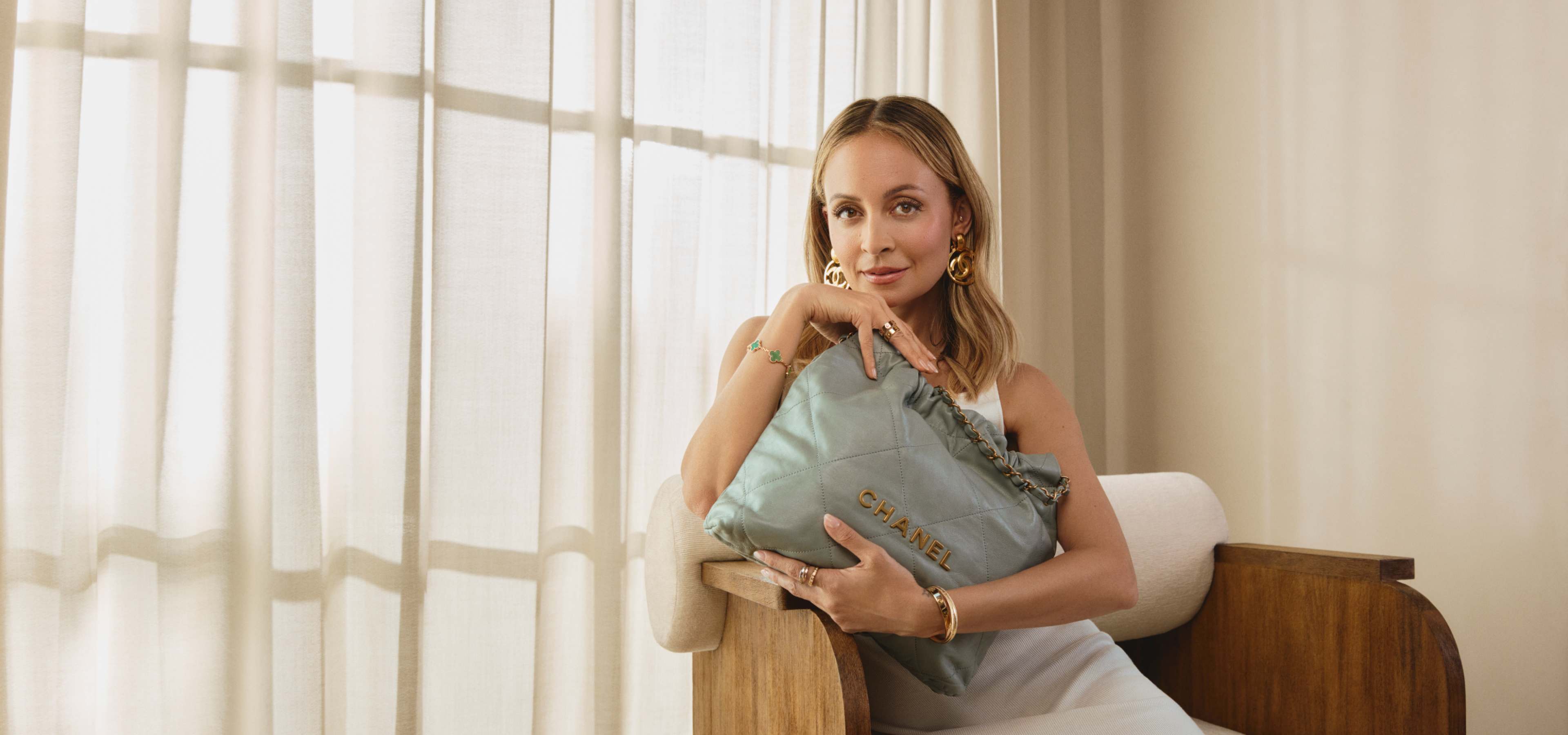 Nicole Richie holding a Chanel 22 bag