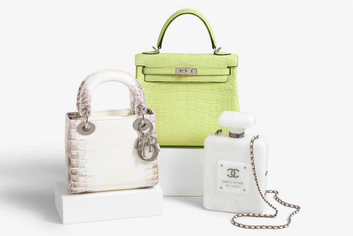 one Christian Dior Niloticus Crocodile Himalaya Crystal Mini Lady Dior White, one Hermes Matte Alligator Kelly Retourne 25 Jaune Bourgeon, and a Chanel Marbled Plexiglass Buonasera Perfume Bottle Clutch White