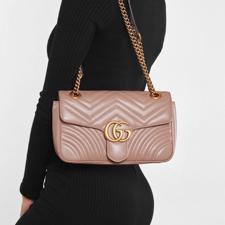 a woman in a black long sleeve dress wearing a GUCCI Calfskin Matelasse GG Marmont Shoulder Bag Porcelain Rose