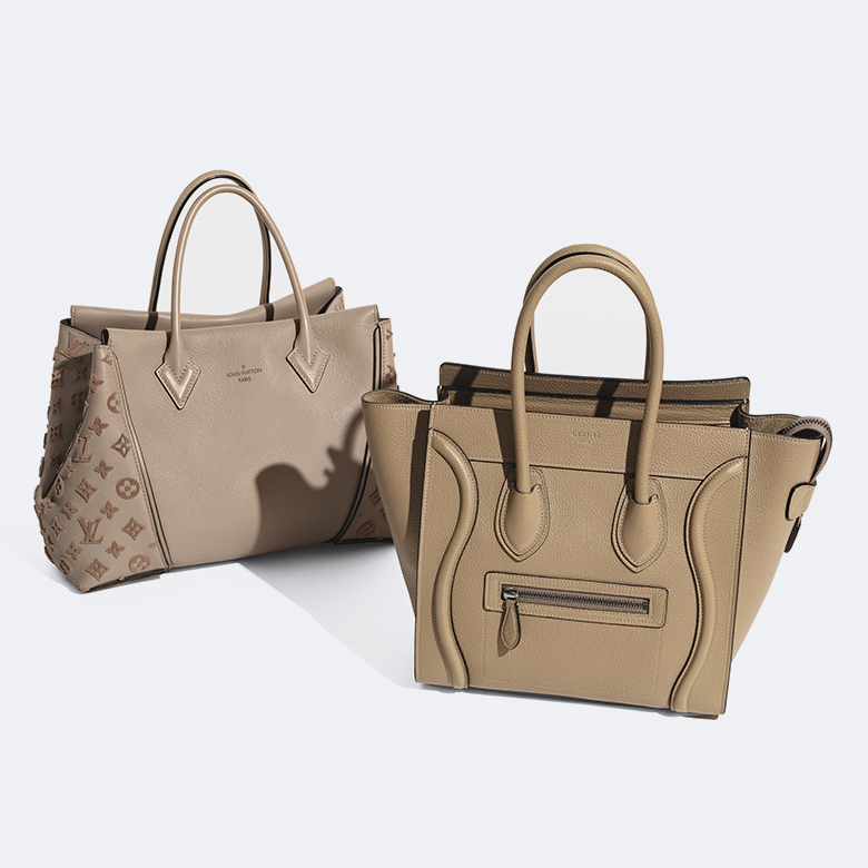one LOUIS VUITTON Veau Cachemire Tote in Galet standing next to one CELINE Drummed Calfskin Luggage in Dune