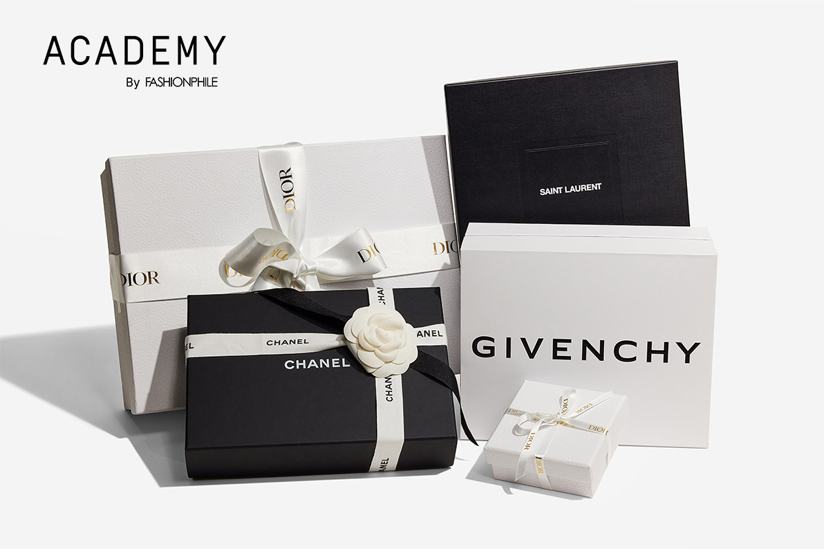 one white Dior box with Dior logo ribbon wrapped around, one black Chanel box with white Chanel logo ribbon wrapped around, one black Saint Laurent box, one white Givenchy logo box, and one small square white Dior box with Dior logo ribbon wrapped around