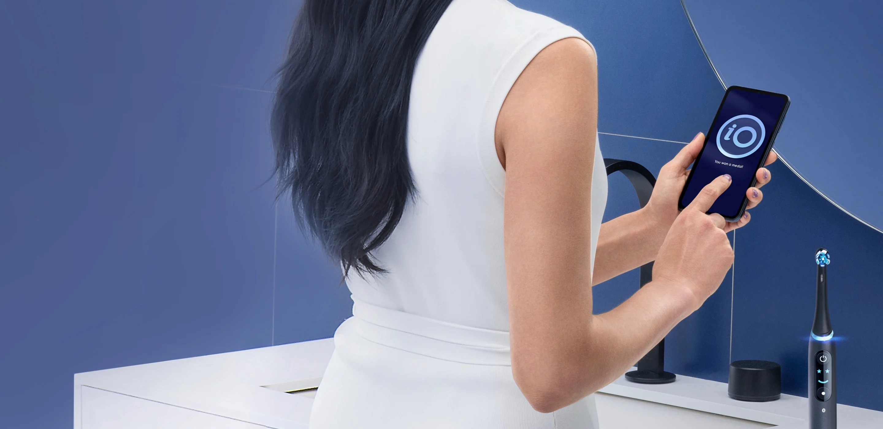 Woman using the oral-b app product