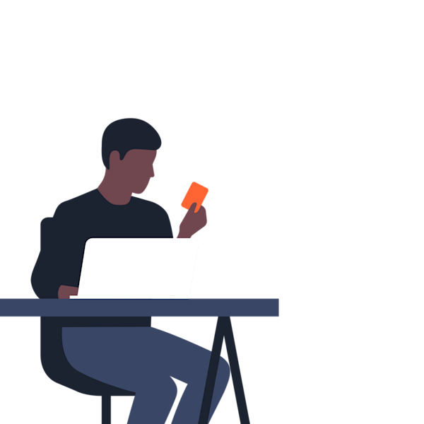 A man sits on a chair, closely examining his credit card while an open notebook rests nearby. He's doing budgeting and financial planning.