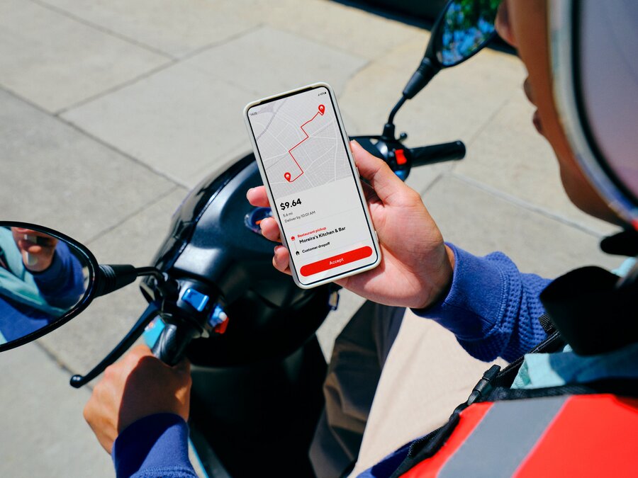 Dx - Dasher on motorcycle using phone to accept an order