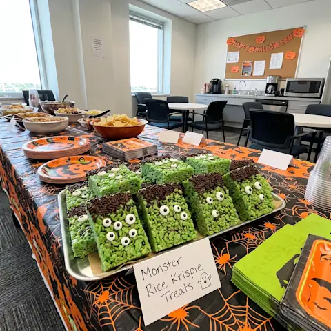 Halloween themed green rice krispie treats in an office