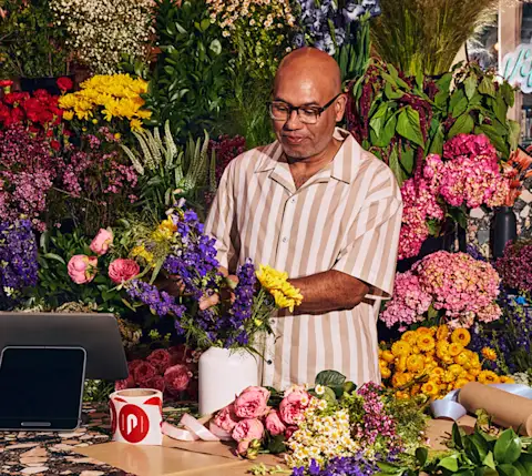 Mx Blog - Top Flower Delivery and Florist Trends 2025 - merchant with flower arrangement