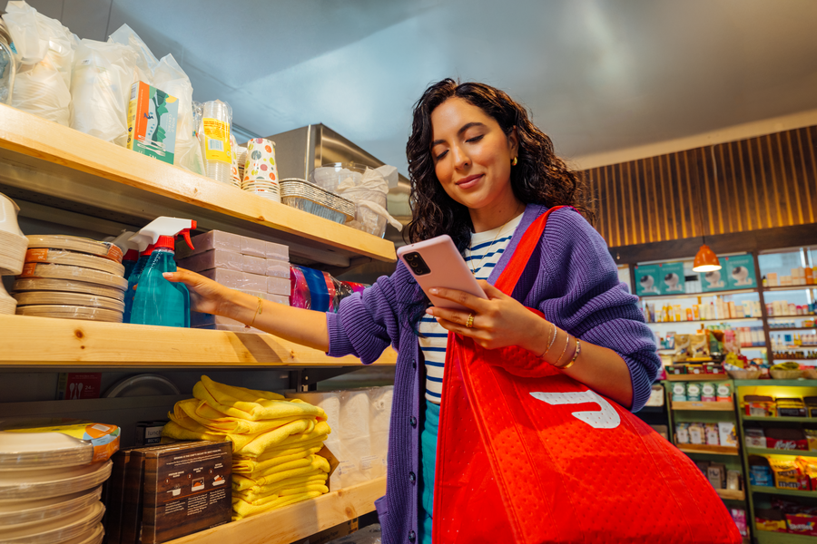 A woman dashing in a convenience store.