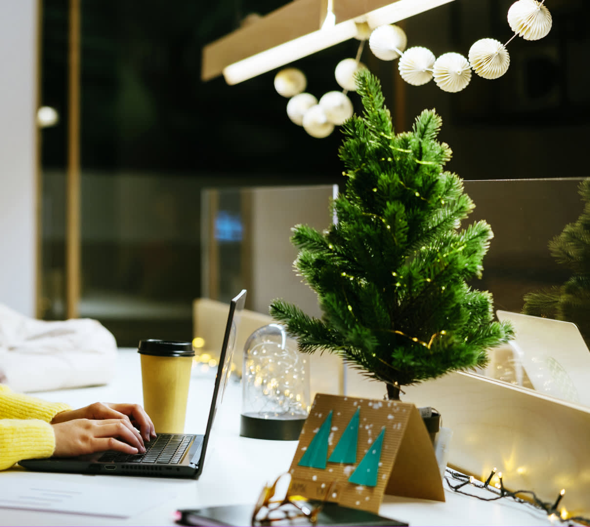 Small tree placed next to a computer