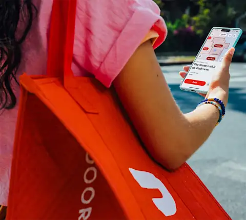 Dx Dasher with bag using map on phone