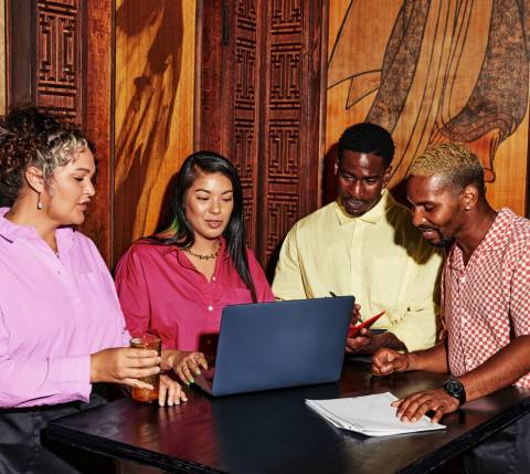 People gathered around computer 