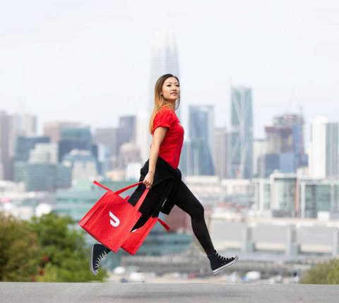 Dasher walking in front of a city skyline