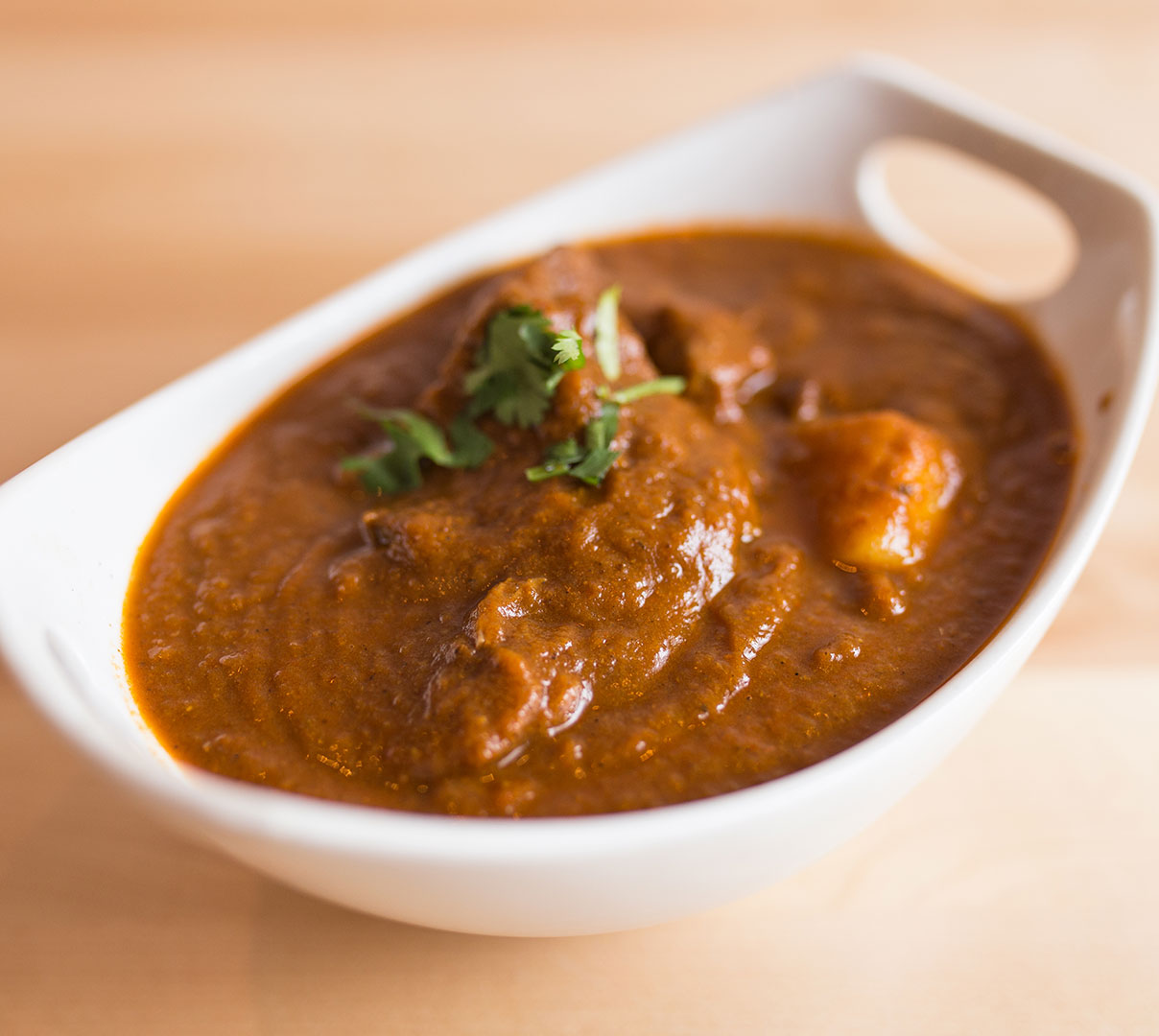 The Best Indian Restaurants In Chicago DoorDash Blog   BestIndianChicago SpiceRoom Lambvindaloo Article 