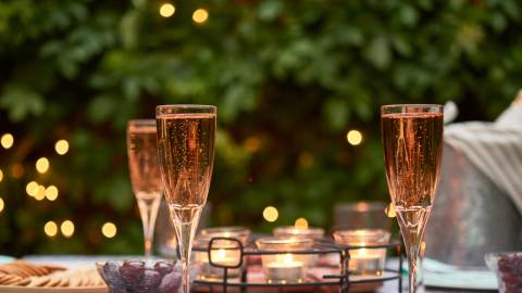 Champagne glasses on an outdoor dining table