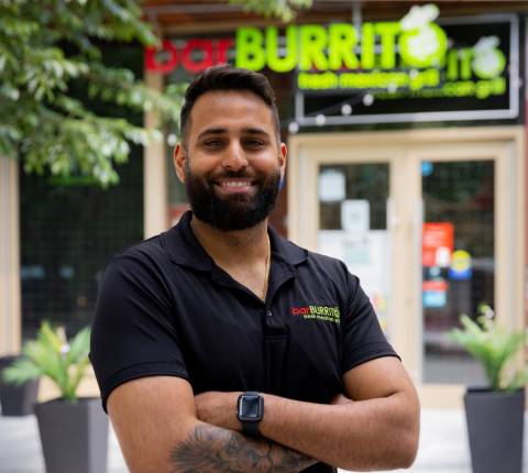 Sunny Singh, owner of BarBurrito in front of his franchise location in the Canary District in Toronto. 