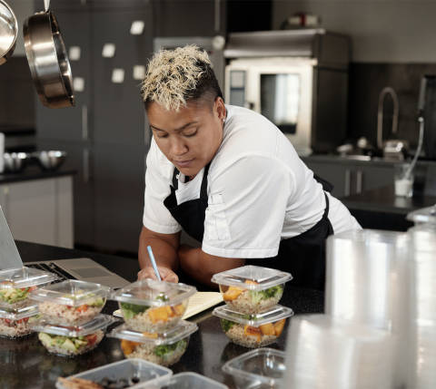 Mx Blog - How to Make Your Commercial Kitchen Layout More Efficient - Chef leaning on counter