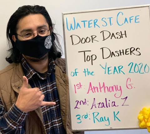 Mx Blog - The Power of a Strong Merchant-Dasher Relationship at Water St. Cafe - Dasher with award giving thumbs-up
