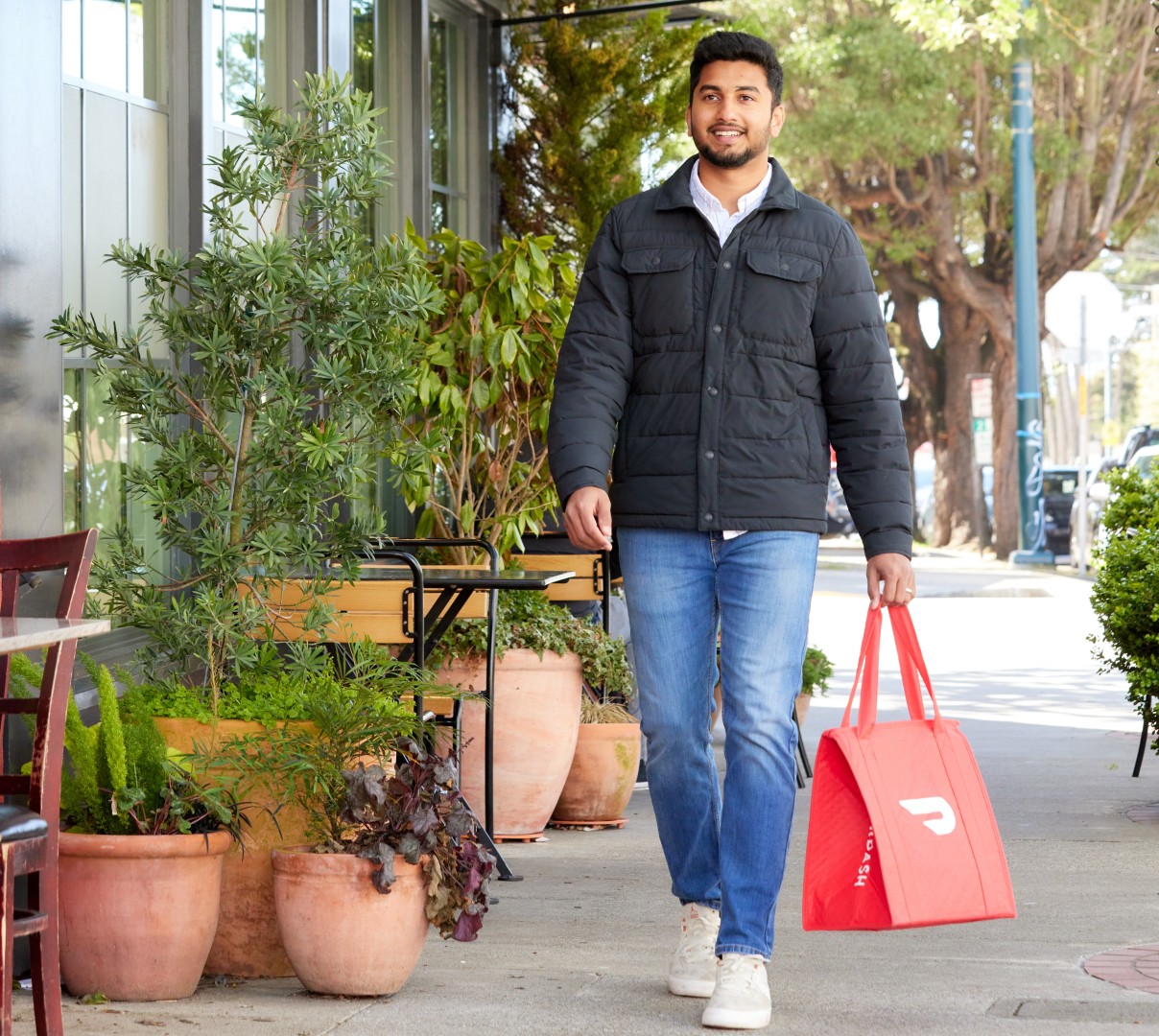 Dasher Walking With Red Bag