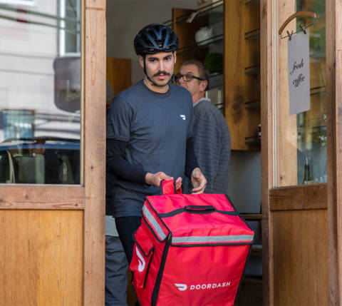 Dx Blog - DoorDash Bike Delivery Guide: Everything You Need to Know about Bike Dashing - Dasher in bike helmet