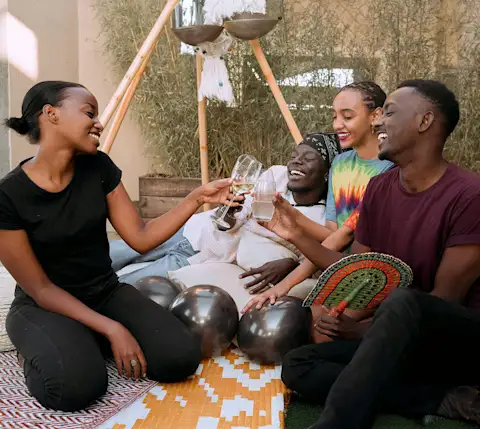 Mx Blog - The Most Popular Alcohol Trends 2024 - Group toasting/celebrating with alcohol