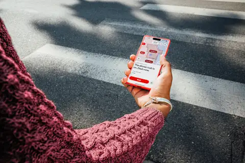 Dasher pulling Crimson card out of wallet