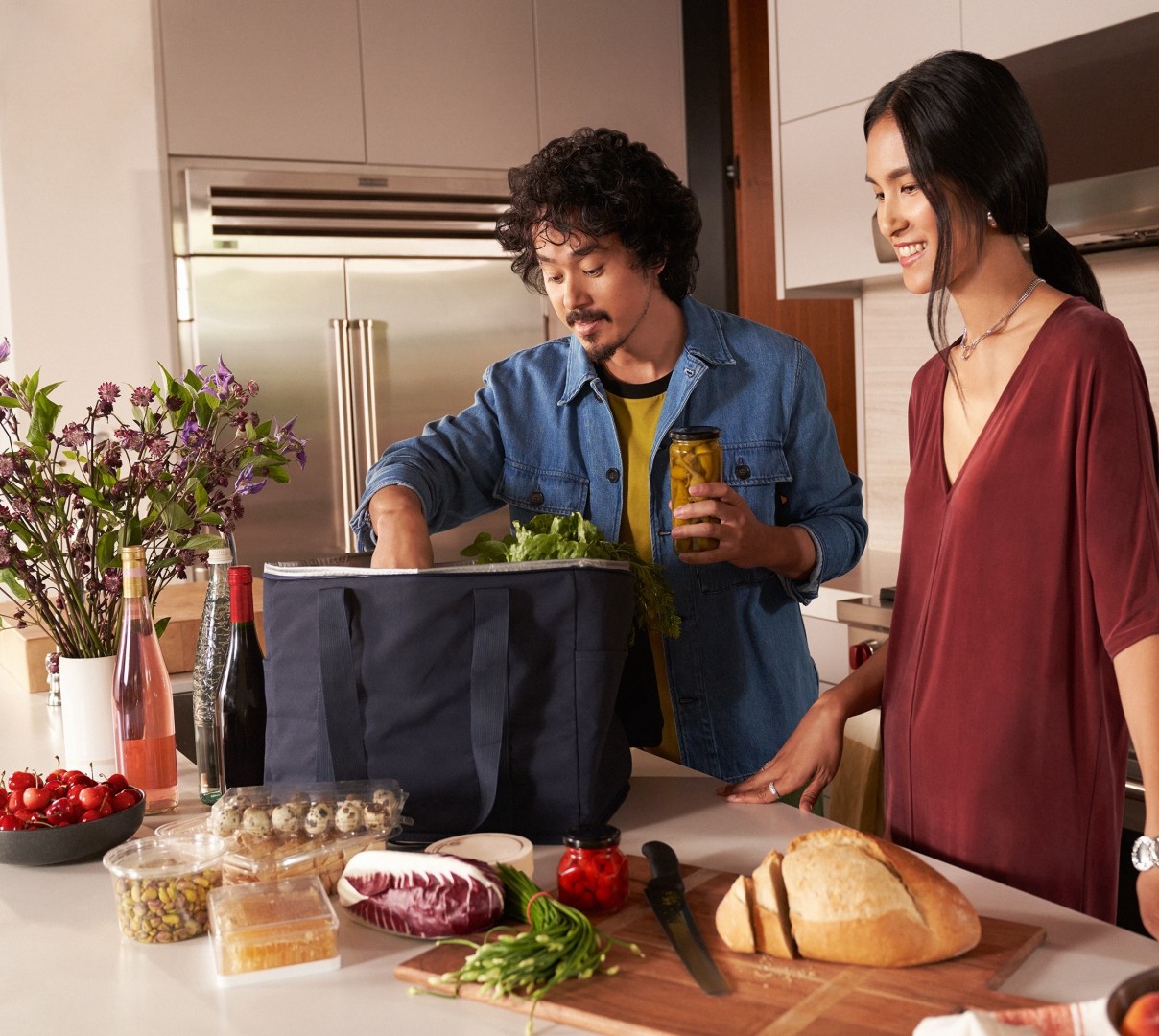 Couple unloading grocery delivery