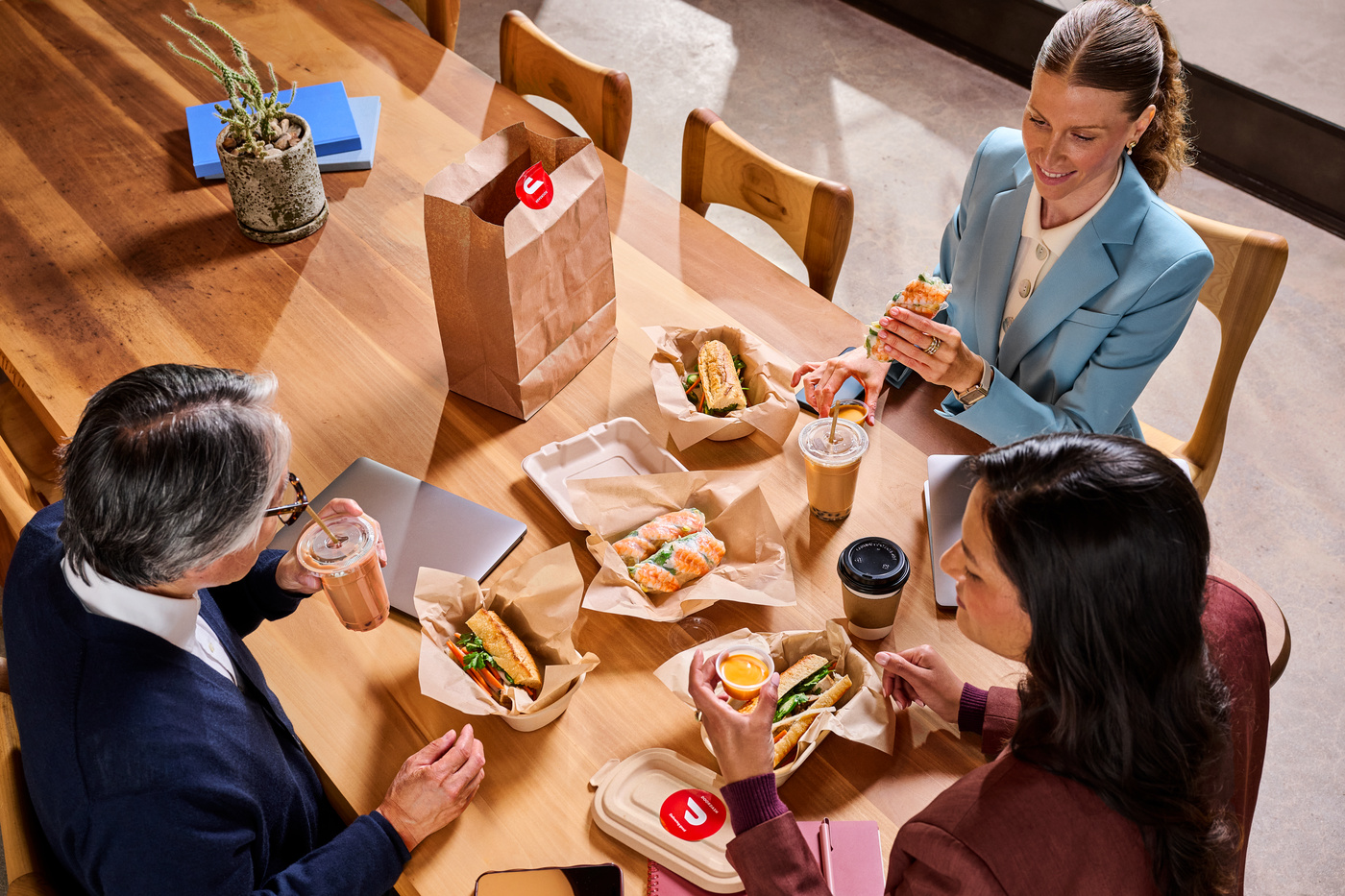 A group of people eating at their office