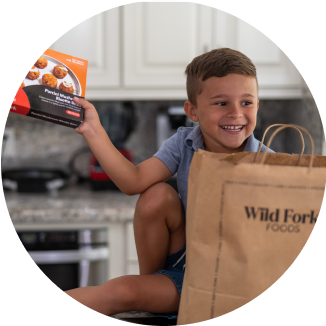 Boy pulling food out of bag 326 x326 png