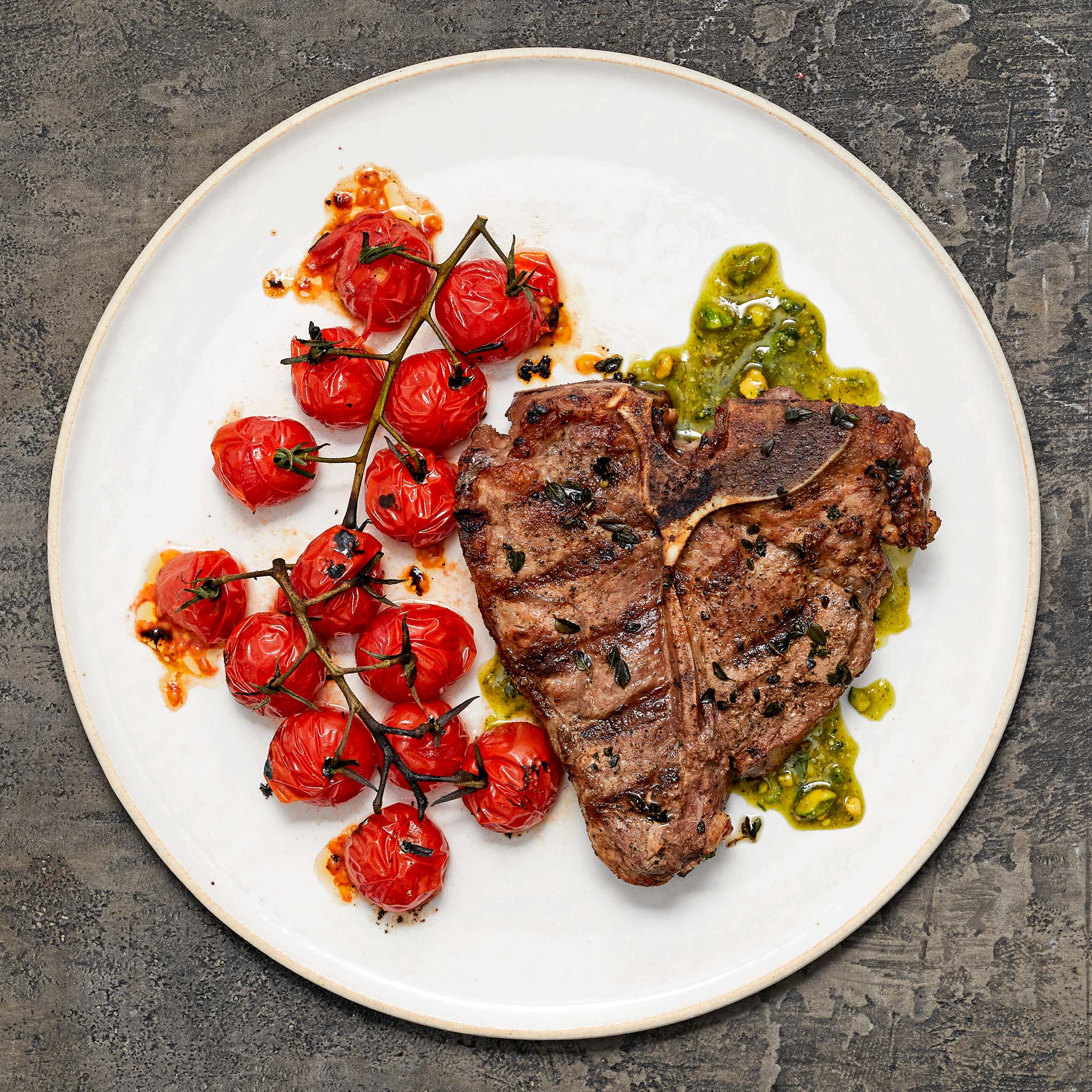 5604 WF PLATED grilled veal loin chop pesto tomatoes Specialty Meats