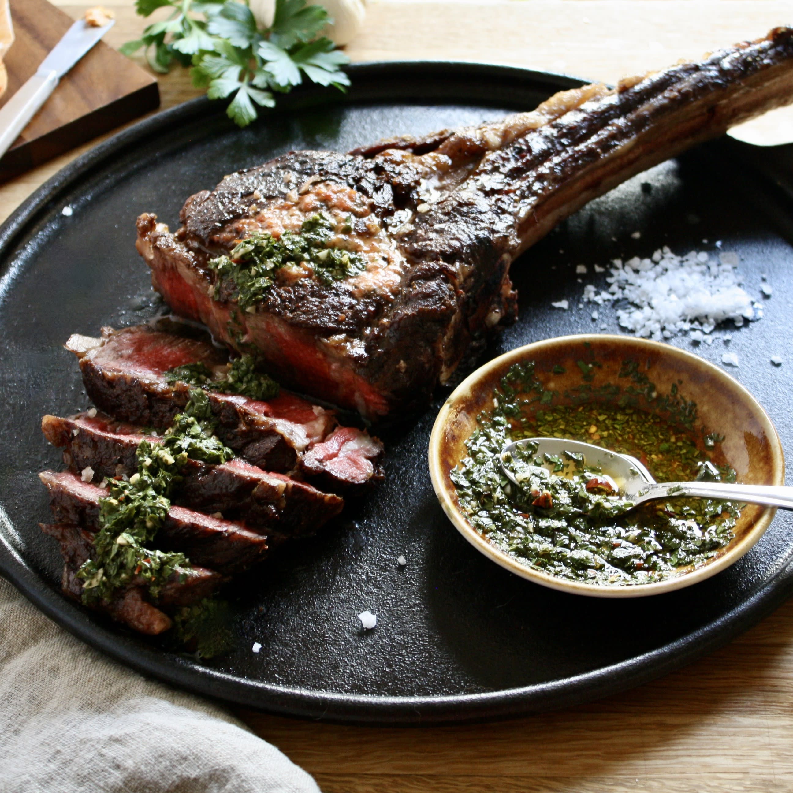 Wagyu Beef Tomahawk Steak with Smoky Red Pepper Compound Butter and Chimichurri