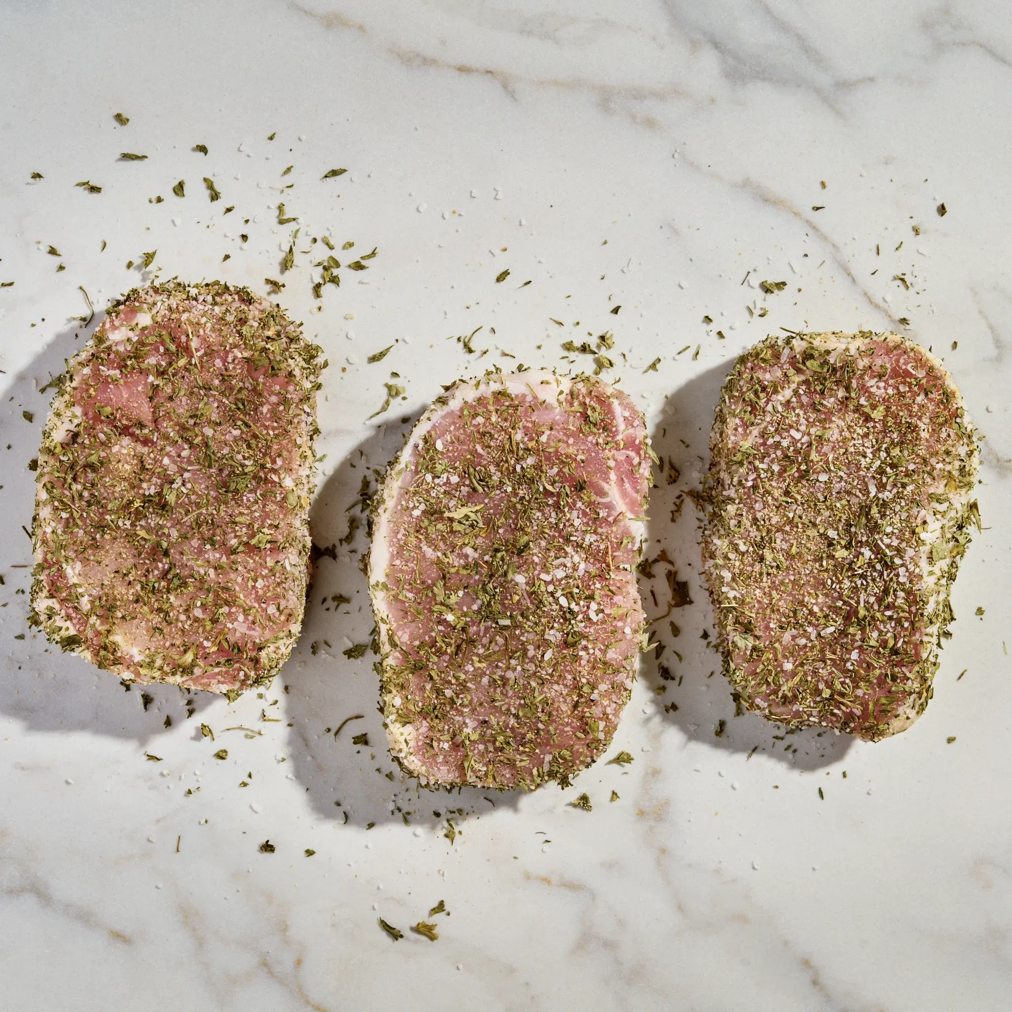 3586_Pork BNLS Ny Chop Garlic Herb_Raw.webp