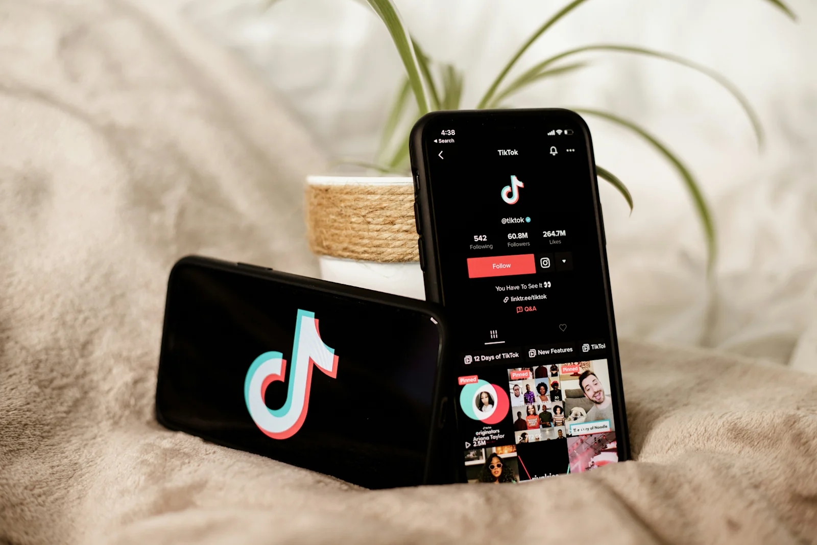 Smartphones showing the TikTok app, highlighting brand visibility and engagement for businesses