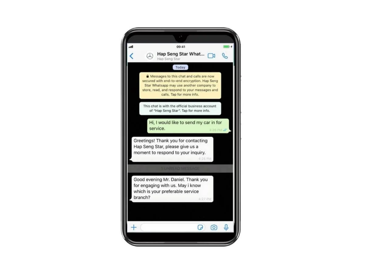 phone screen showing hap seng star whatsapp chat for car service inquiry