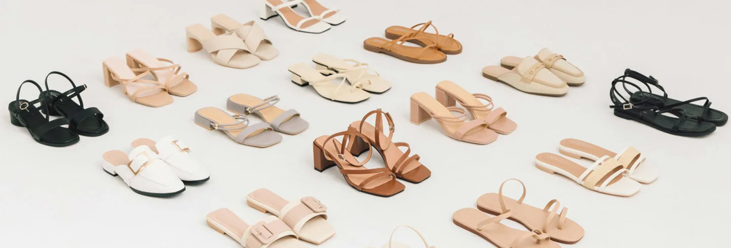 flat lay of various neutral-toned footwear