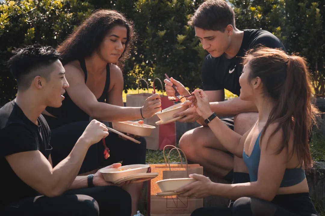 People eating healthy meals from Nutrition Kitchen