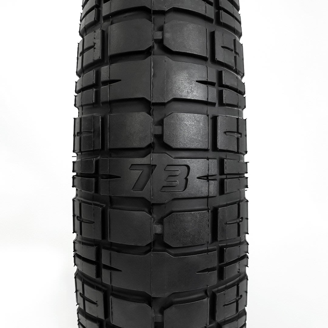 Front detail view of a single GRZLY Tire 20" x 5"