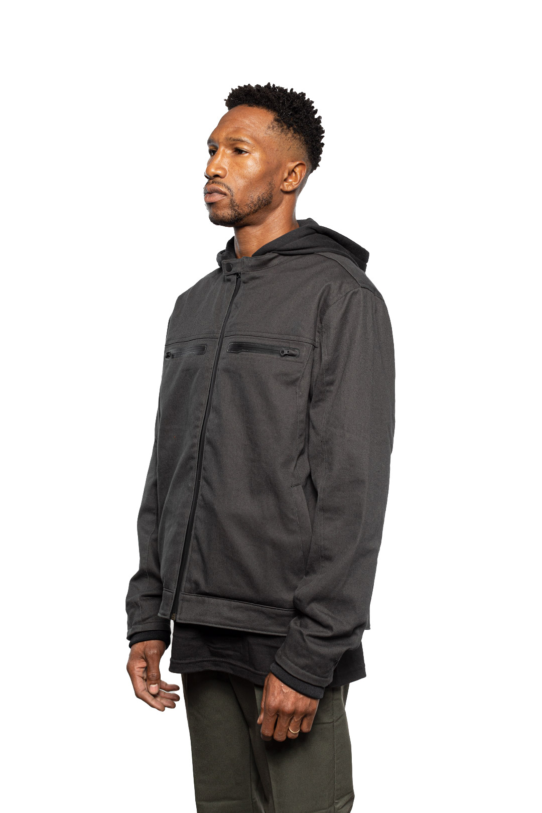 Side view of Male model wearing Chisel Hooded Jacket in gravel colorway.