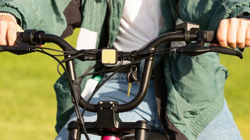 Clip on Knog headlight attached to center front of handlebars