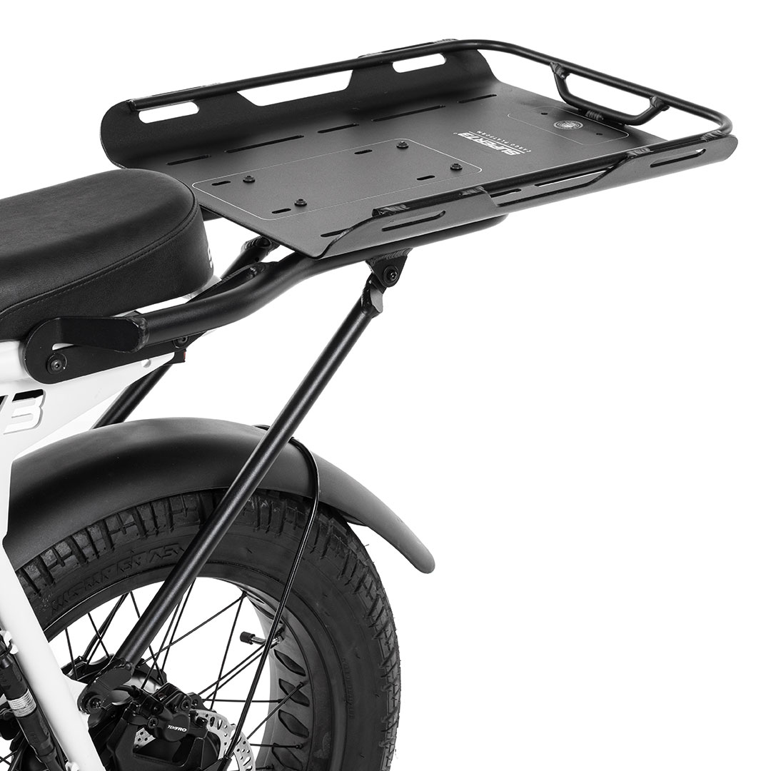 angled image of reversible cargo platform mounted to bike.