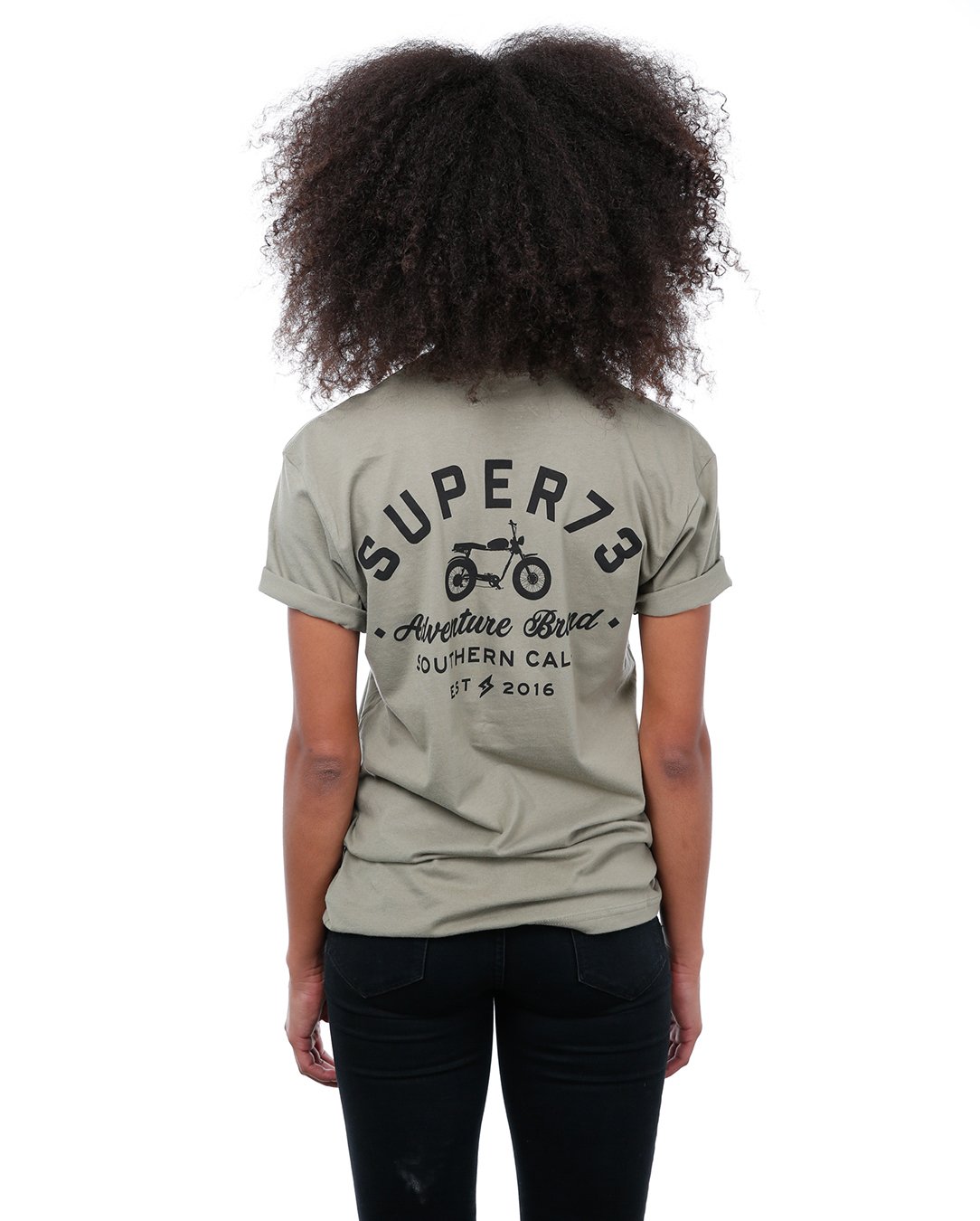 Back view of female model in Light olive Adventure Short Sleeve T-Shirt on white background.