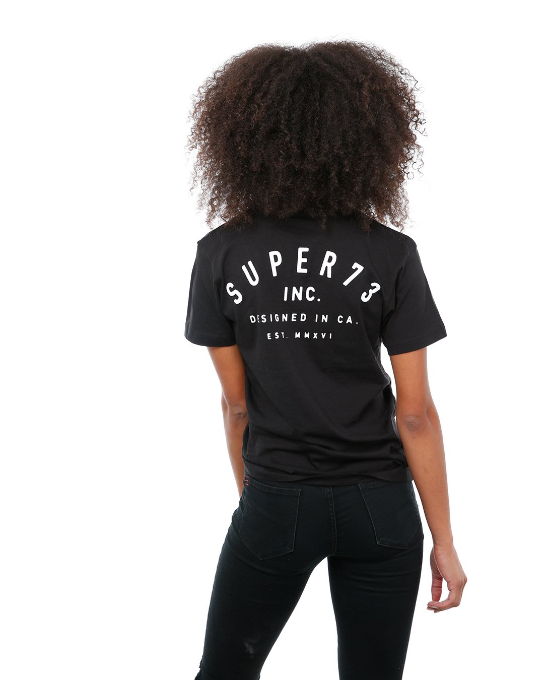 Back view of female model in Black Classic Short Sleeve T-Shirt on white background.