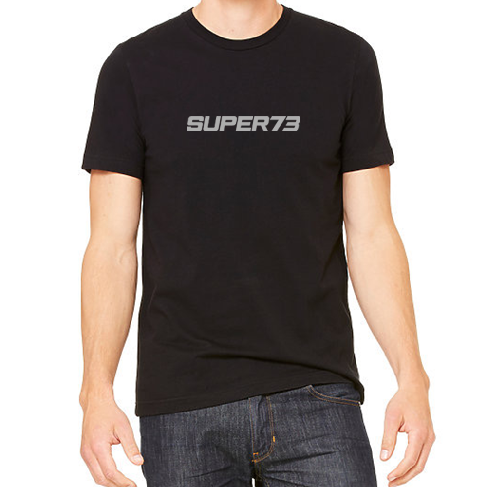 Front view of male model in Black Logo Tee on white background.