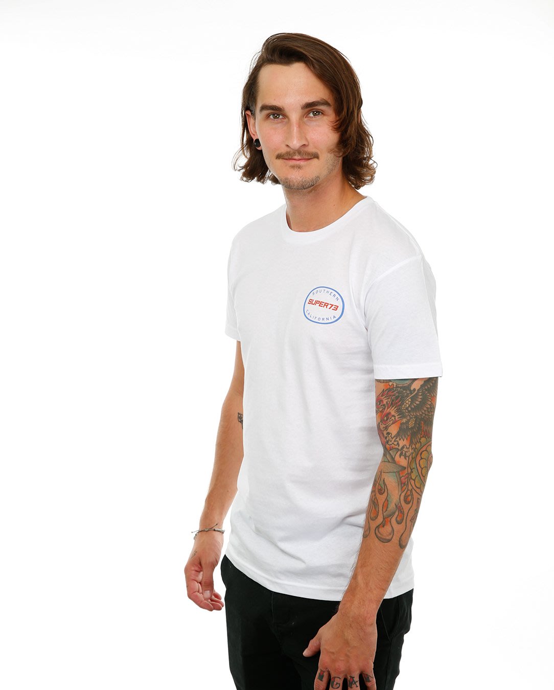 Front view of male model in White Oval Tee on white background.
