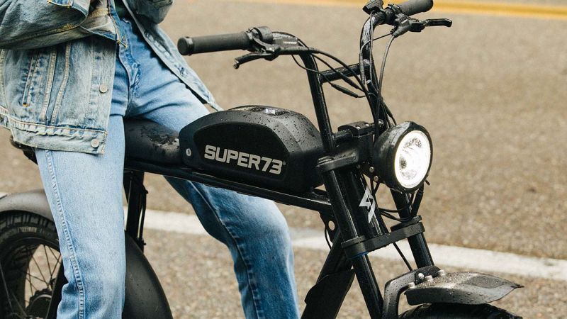 Super73 LP ElectricBikes MoreThanATrend 1920x1080 man sitting on the bike showcasing the battery