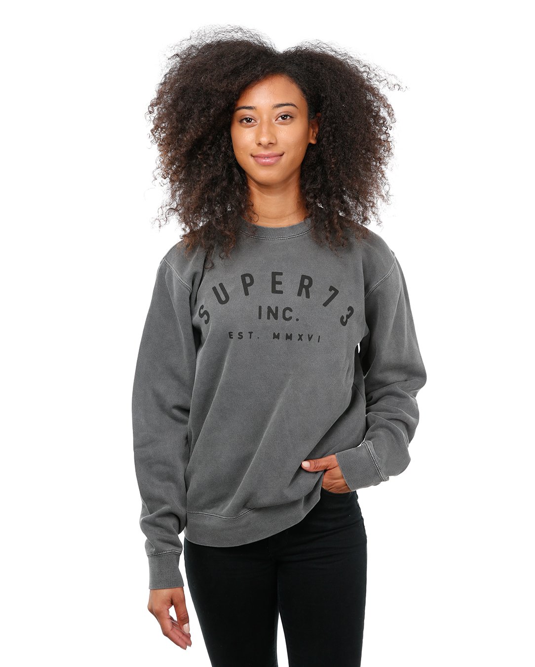 Front view of female model in Pigment Black Classic Crew Sweatshirt on white background.