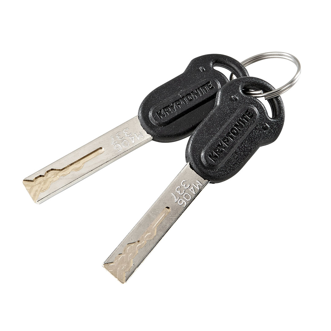 Kryptonite folding lock keys on white background 