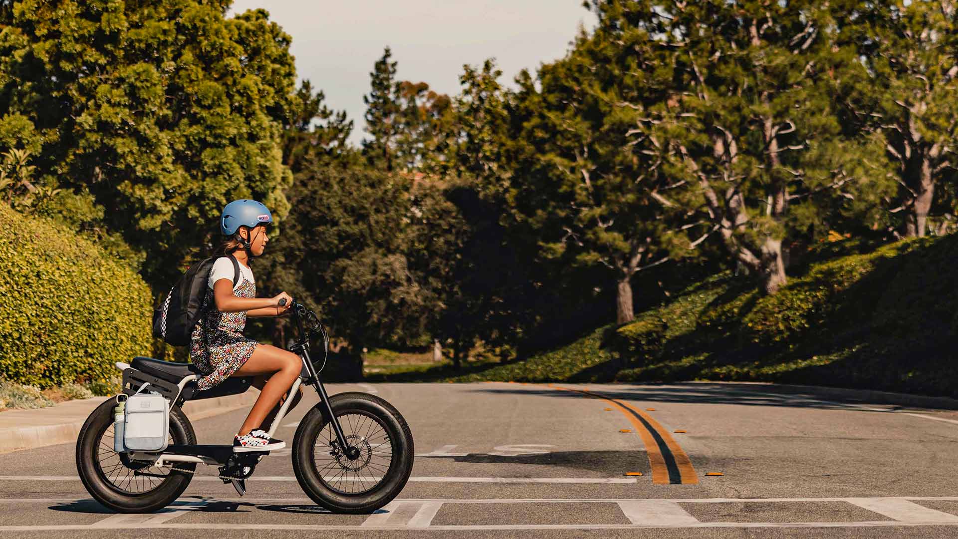 Lifestyle image of a student riding her Z Miami to school.