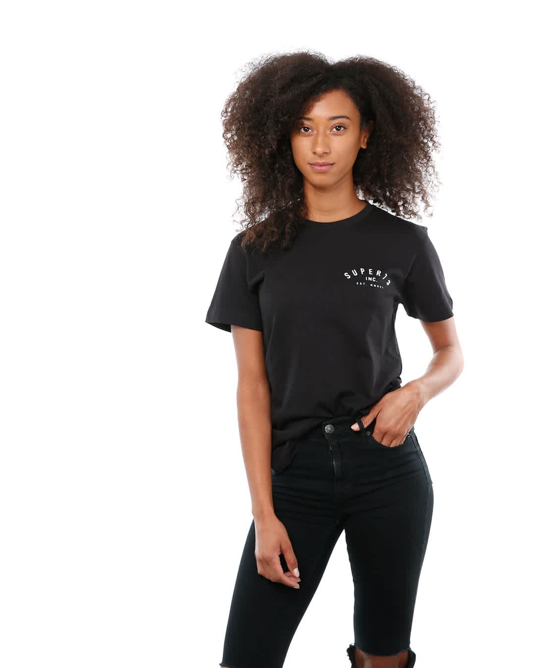 Front view of female model in Black Classic Short Sleeve T-Shirt on white background.