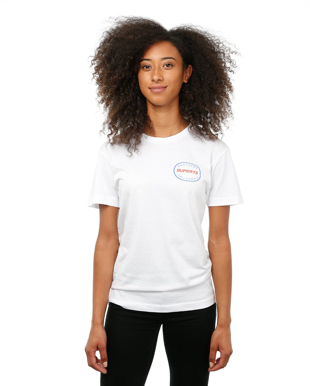Front view of female model in White Oval Tee on white background.
