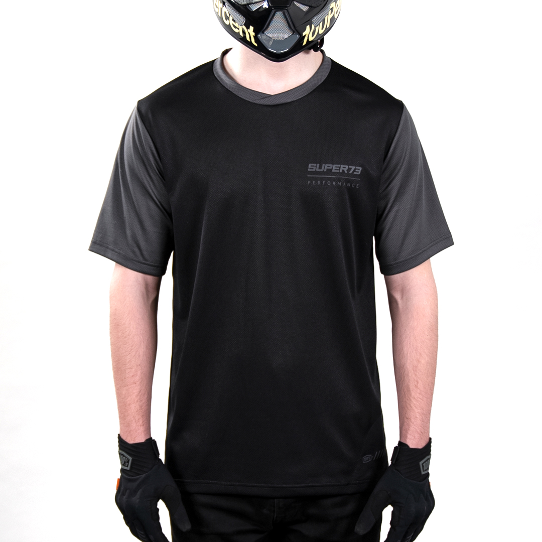 Male model wearing 100% x Super73 Ridecamp short sleeve Jersey.